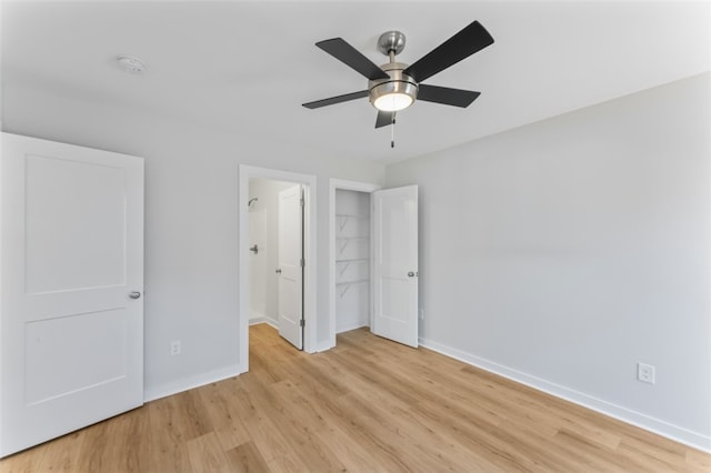 unfurnished bedroom featuring ceiling fan and light hardwood / wood-style floors