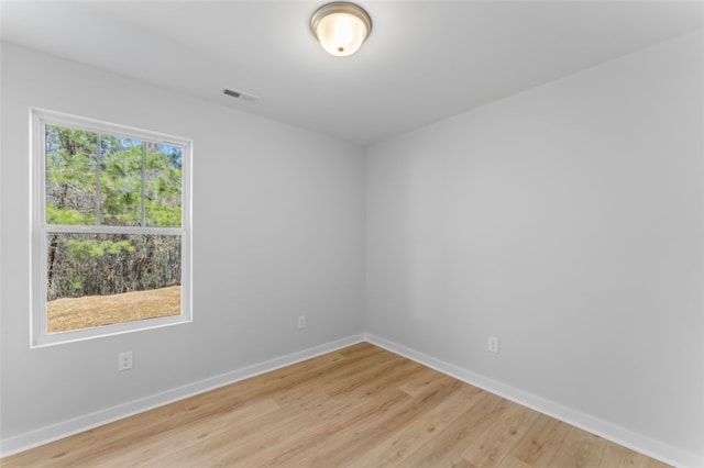 unfurnished room featuring light hardwood / wood-style flooring