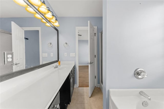 bathroom with vanity and tile patterned flooring