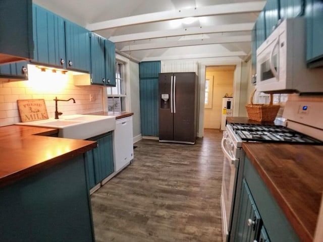 kitchen with decorative backsplash, white appliances, blue cabinetry, and dark wood-type flooring