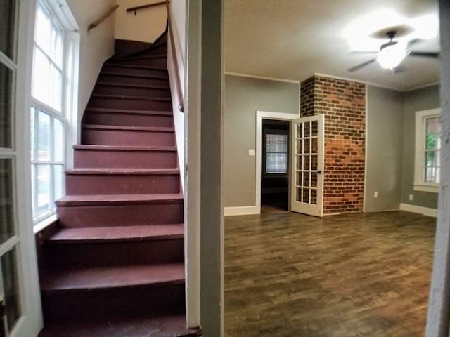 staircase with hardwood / wood-style flooring, ceiling fan, and french doors