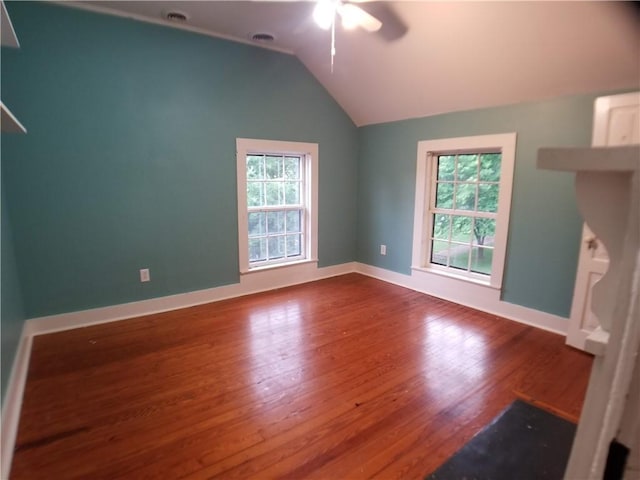 unfurnished bedroom with hardwood / wood-style flooring, vaulted ceiling, and ceiling fan