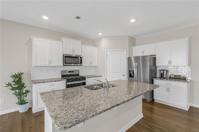 kitchen featuring white cabinets, a center island with sink, stainless steel appliances, and sink