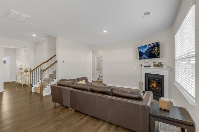 living room featuring dark wood-type flooring