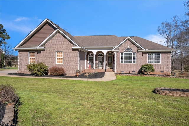 single story home featuring a porch and a front yard