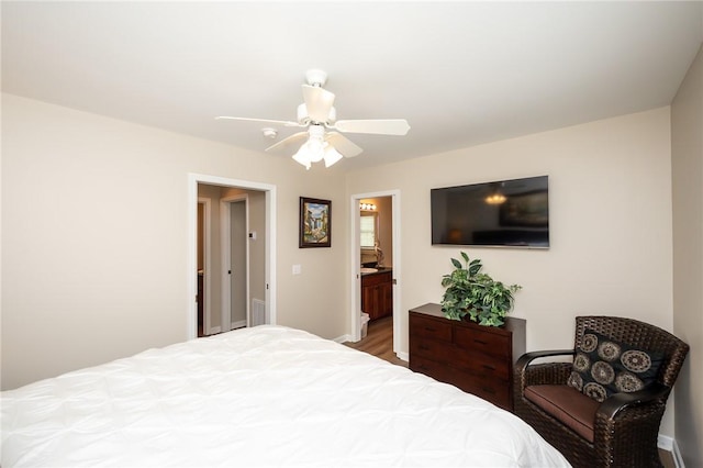 bedroom featuring ceiling fan and ensuite bath