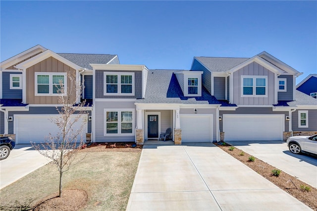 view of front of property featuring board and batten siding, concrete driveway, and an attached garage