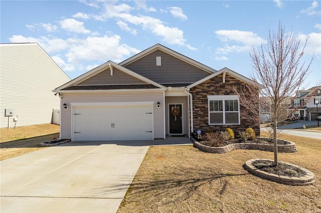 view of front of house featuring a garage, concrete driveway, a front lawn, and stone siding