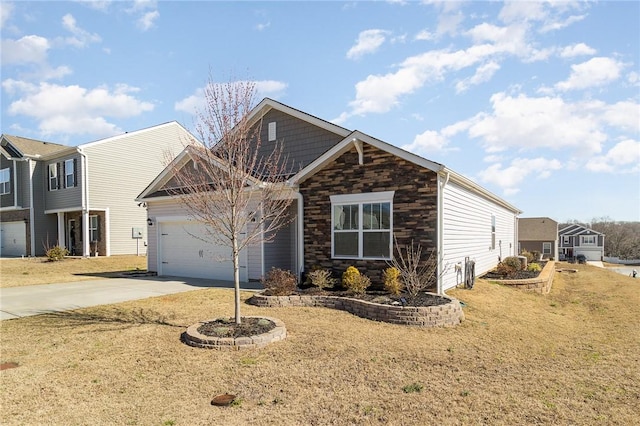 view of front of home featuring an attached garage, stone siding, a front lawn, and concrete driveway