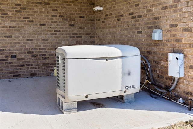 details with brick siding and a power unit