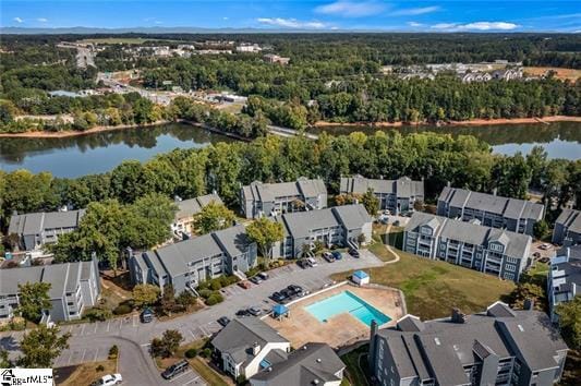 drone / aerial view with a water view and a residential view