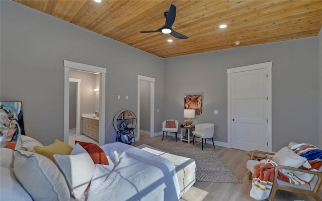 bedroom with recessed lighting, light wood-style flooring, connected bathroom, wooden ceiling, and baseboards