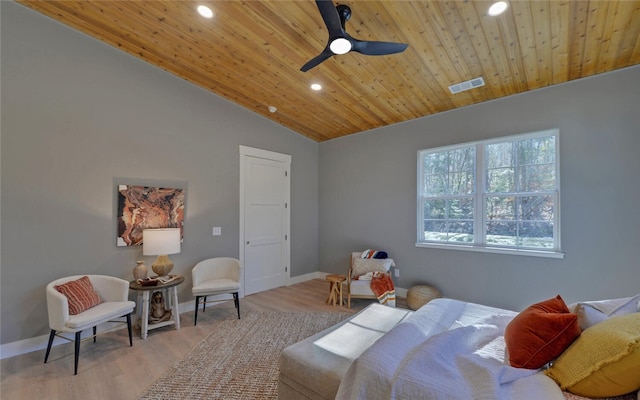 bedroom with light wood-style floors, wood ceiling, and baseboards