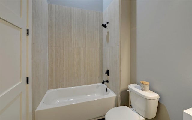 bathroom with toilet and bathing tub / shower combination