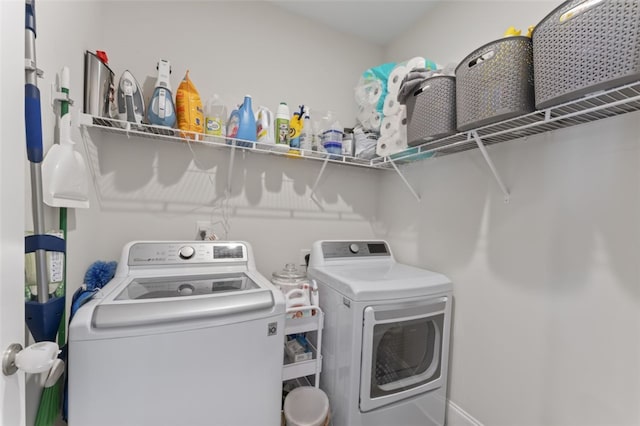 laundry area featuring laundry area and washer and clothes dryer