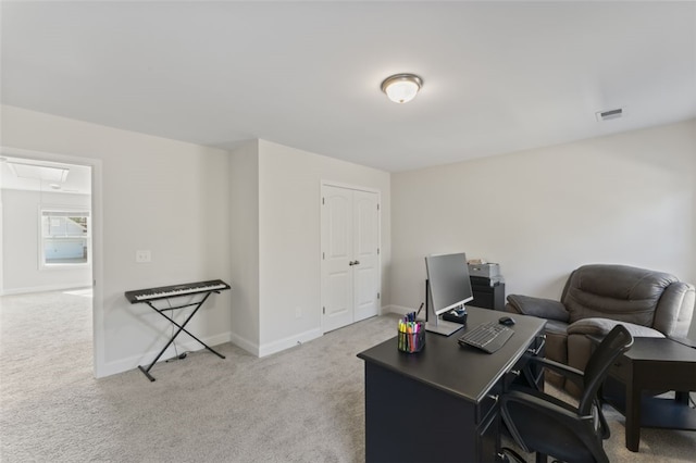 home office featuring attic access, visible vents, light carpet, and baseboards