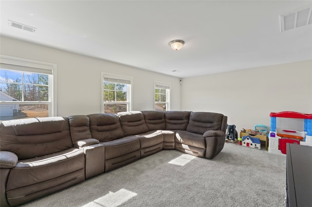 living room with carpet floors and visible vents