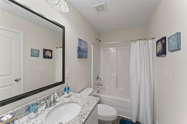 bathroom featuring visible vents, shower / tub combo with curtain, vanity, and toilet