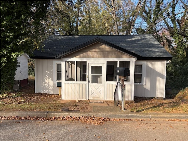 exterior space with a shingled roof