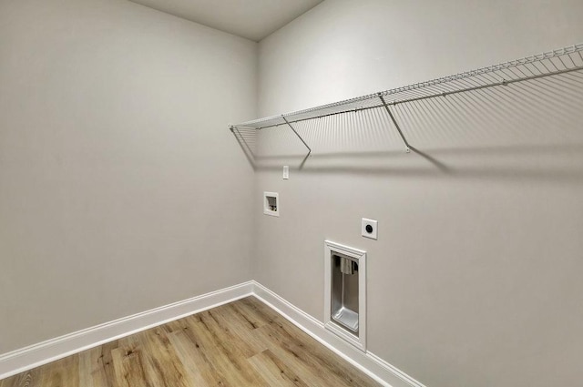 laundry room featuring light wood-style flooring, laundry area, washer hookup, baseboards, and electric dryer hookup