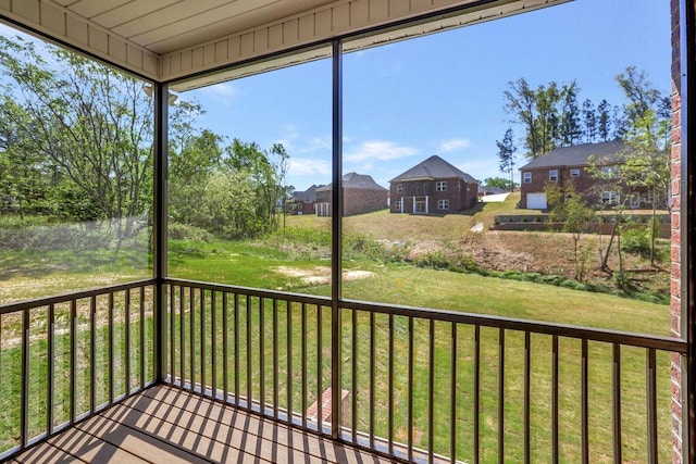 unfurnished sunroom featuring a residential view