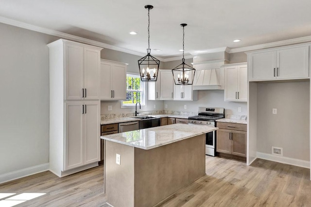 kitchen featuring white cabinetry, stainless steel appliances, and a center island