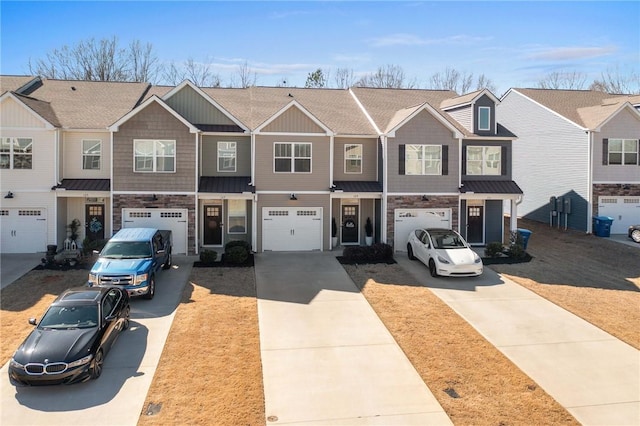 129 Rushing Creek Ln, Piedmont, SC 29673 - townhome / multi-family property featuring an attached garage, driveway, stone siding, a residential view, and a standing seam roof