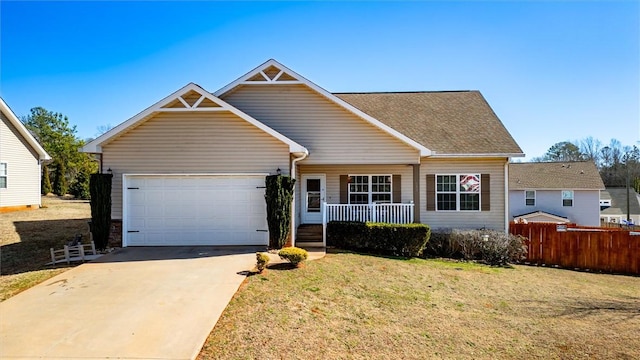 view of front facade featuring a porch, concrete driveway, a front lawn, and an attached garage