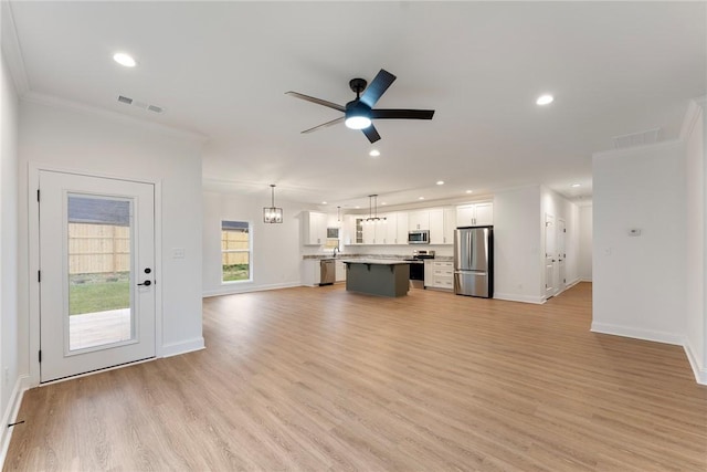 unfurnished living room with light wood-type flooring, visible vents, a ceiling fan, and recessed lighting