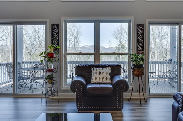 sunroom / solarium with a mountain view