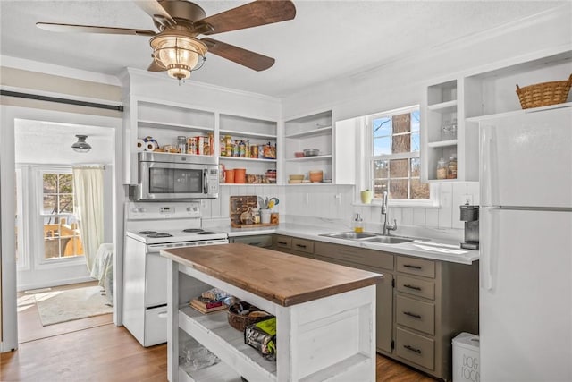 93 Parnell Rd, Abbeville, SC 29620 - kitchen with open shelves, white appliances, butcher block countertops, a sink, and a kitchen island