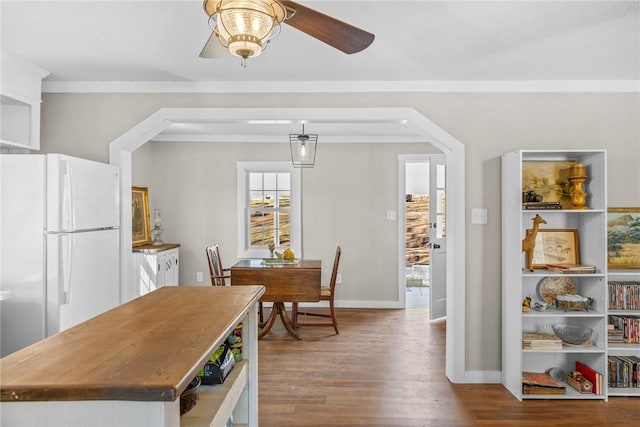 93 Parnell Rd, Abbeville, SC 29620 - dining room featuring wood finished floors, a ceiling fan, baseboards, and arched walkways