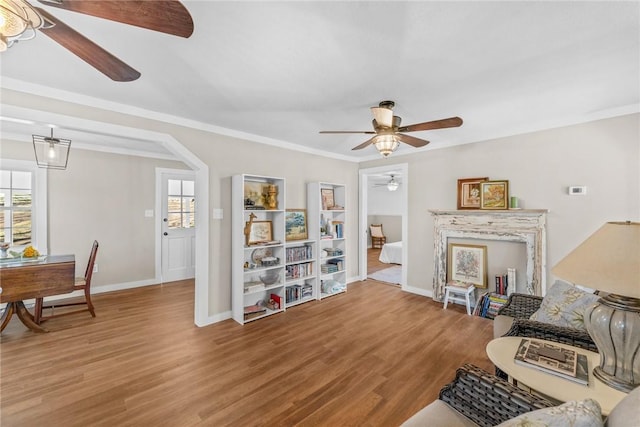 93 Parnell Rd, Abbeville, SC 29620 - living room featuring a ceiling fan, healthy amount of natural light, baseboards, wood finished floors, and ornamental molding