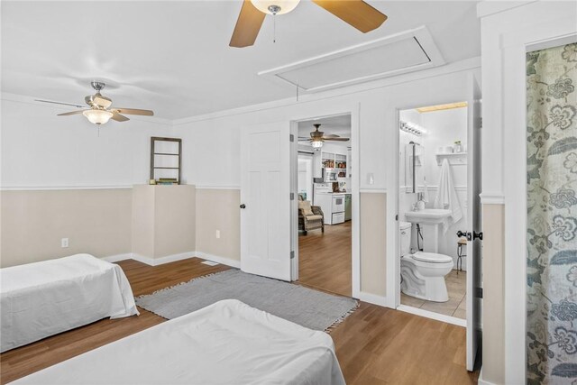 93 Parnell Rd, Abbeville, SC 29620 - bedroom with attic access, wood finished floors, ensuite bath, and ceiling fan