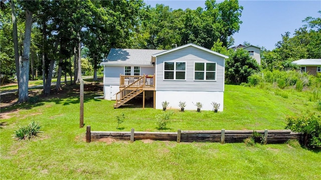 93 Parnell Rd, Abbeville, SC 29620 - rear view of house with stairs, a wooden deck, and a lawn