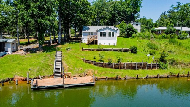 93 Parnell Rd, Abbeville, SC 29620 - back of property with stairs and a deck with water view