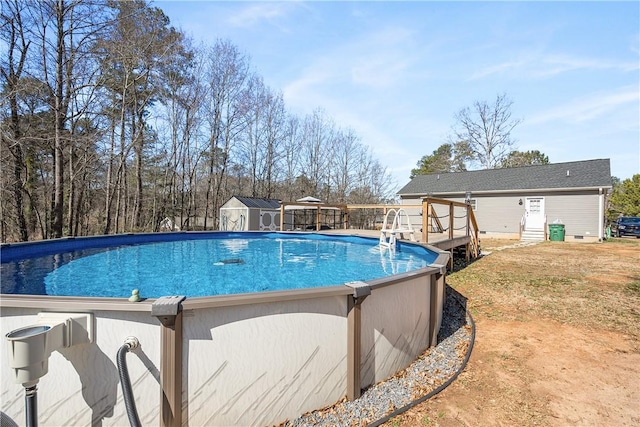 outdoor pool with a deck and an outdoor structure