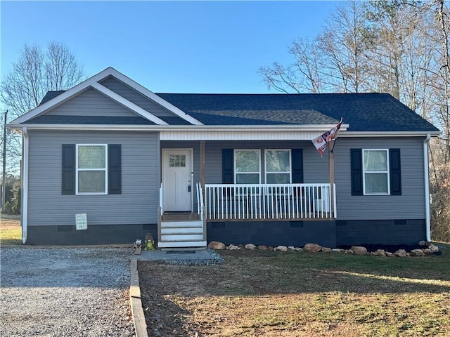 view of front of property with a porch, crawl space, a shingled roof, and a front lawn