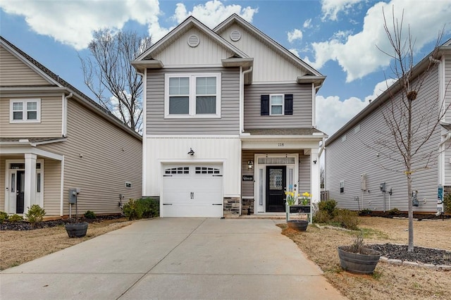 craftsman house with concrete driveway, stone siding, board and batten siding, and an attached garage