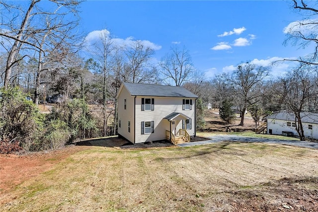 view of outdoor structure with driveway