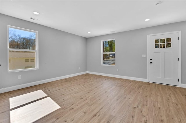 interior space featuring light wood-style floors, recessed lighting, and baseboards