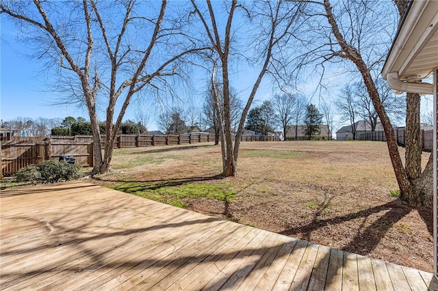 view of yard with a fenced backyard and a deck