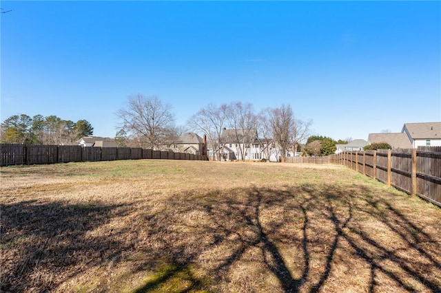 view of yard with a fenced backyard