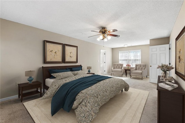 bedroom with light colored carpet, ceiling fan, a textured ceiling, and baseboards