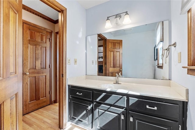 bathroom featuring vanity and wood finished floors