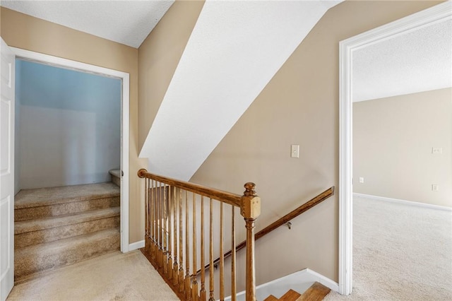 staircase with carpet flooring and baseboards