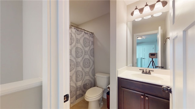 full bathroom with toilet and vanity