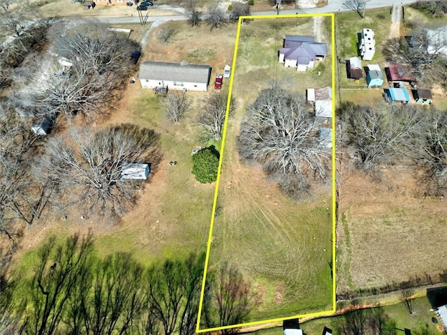 birds eye view of property featuring a rural view