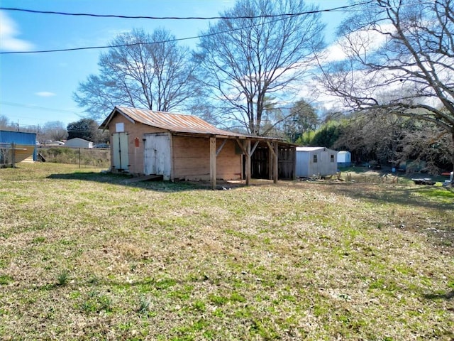 view of shed featuring fence