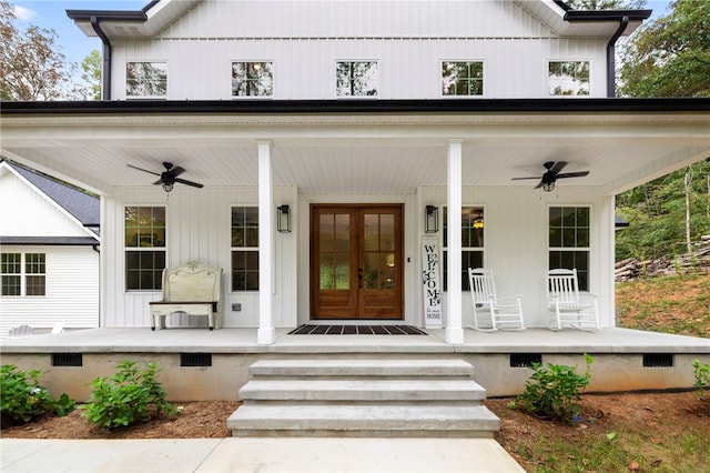 entrance to property with crawl space, ceiling fan, a porch, and french doors